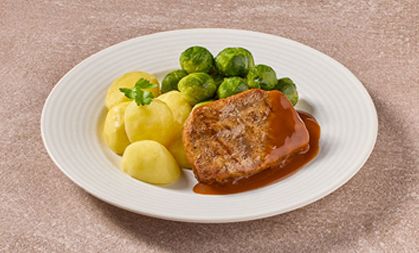 Varkenslapje met spruitjes en aardapplen