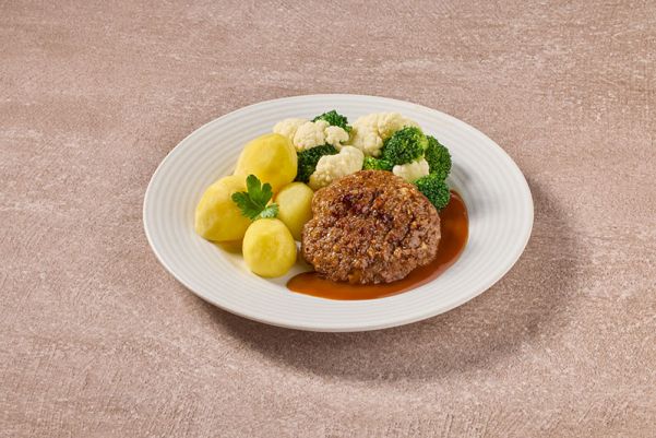 Gehaktbal in jus met bloemkool- en broccoliroosjes en gekookte aardappelen